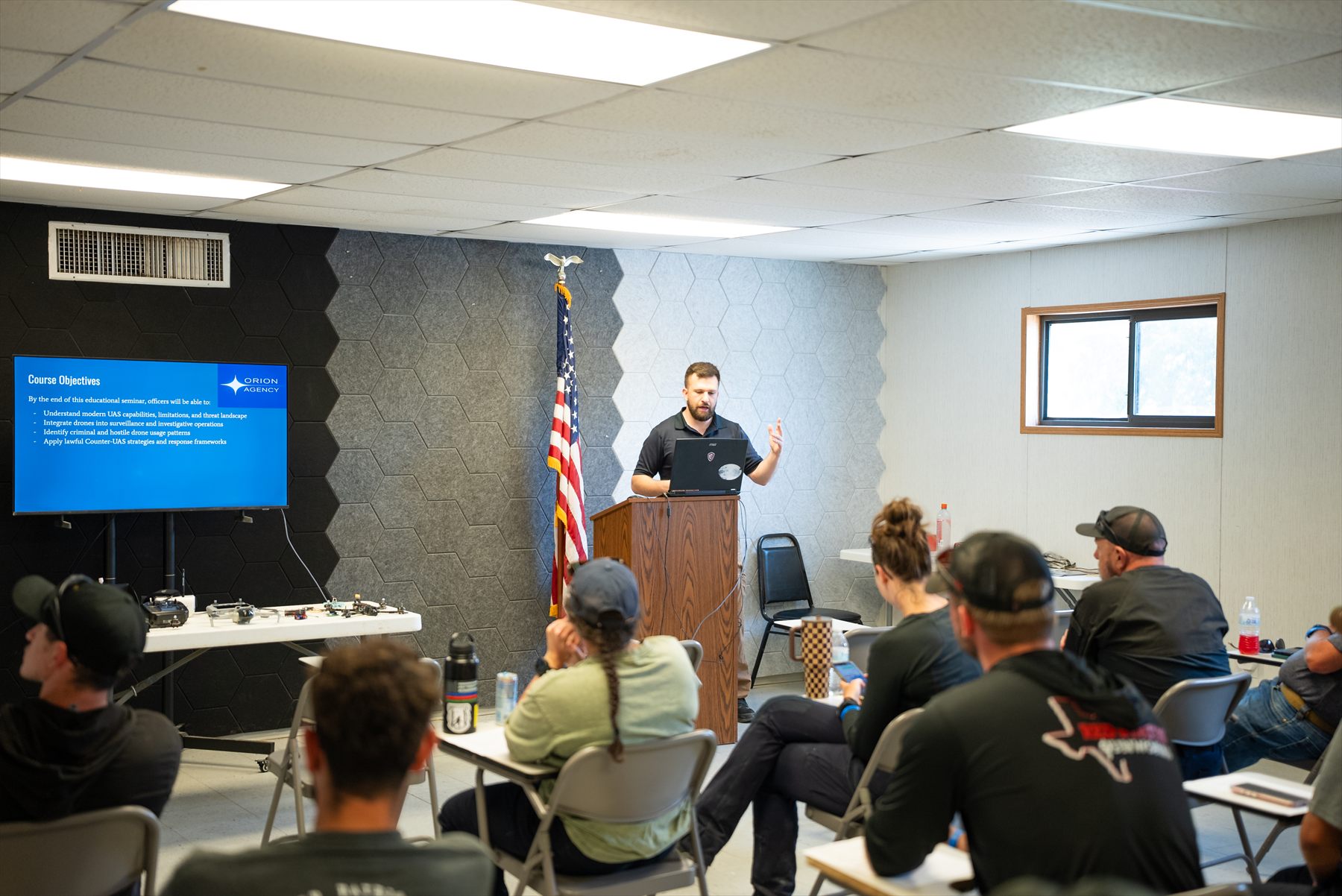 Instructor leading a tactical drone classroom briefing